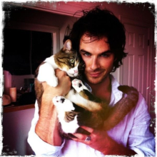 Ian and one of his cats.