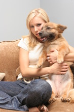 Kristen Bell holds one of her three pooches