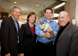 Dan Edelman (President of Macy's West), Jan McHugh Smith (President of the SF/SPCA), Steve Young (San Francisco 49er, with adoptable pup Snowflake), and Robert Mettler (Chairman and CEO of Macy's West).