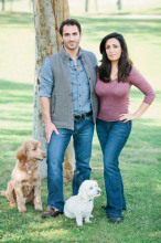 DogVacay.com's CEO Aaron Hirschhorn and cofounder and wife Karine Nissan Hirschhorn hang out in the park with Rocky and Rambo. 