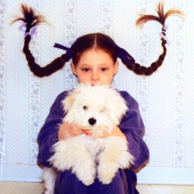 A young Coco with her childhood dog; Pepsi.