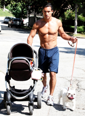 Mario Lopez walking with stroller and dog