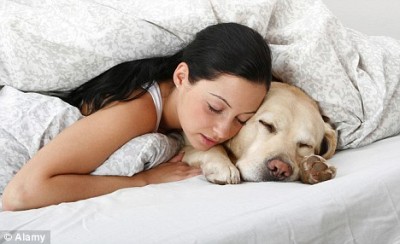 girl sleeping with pet